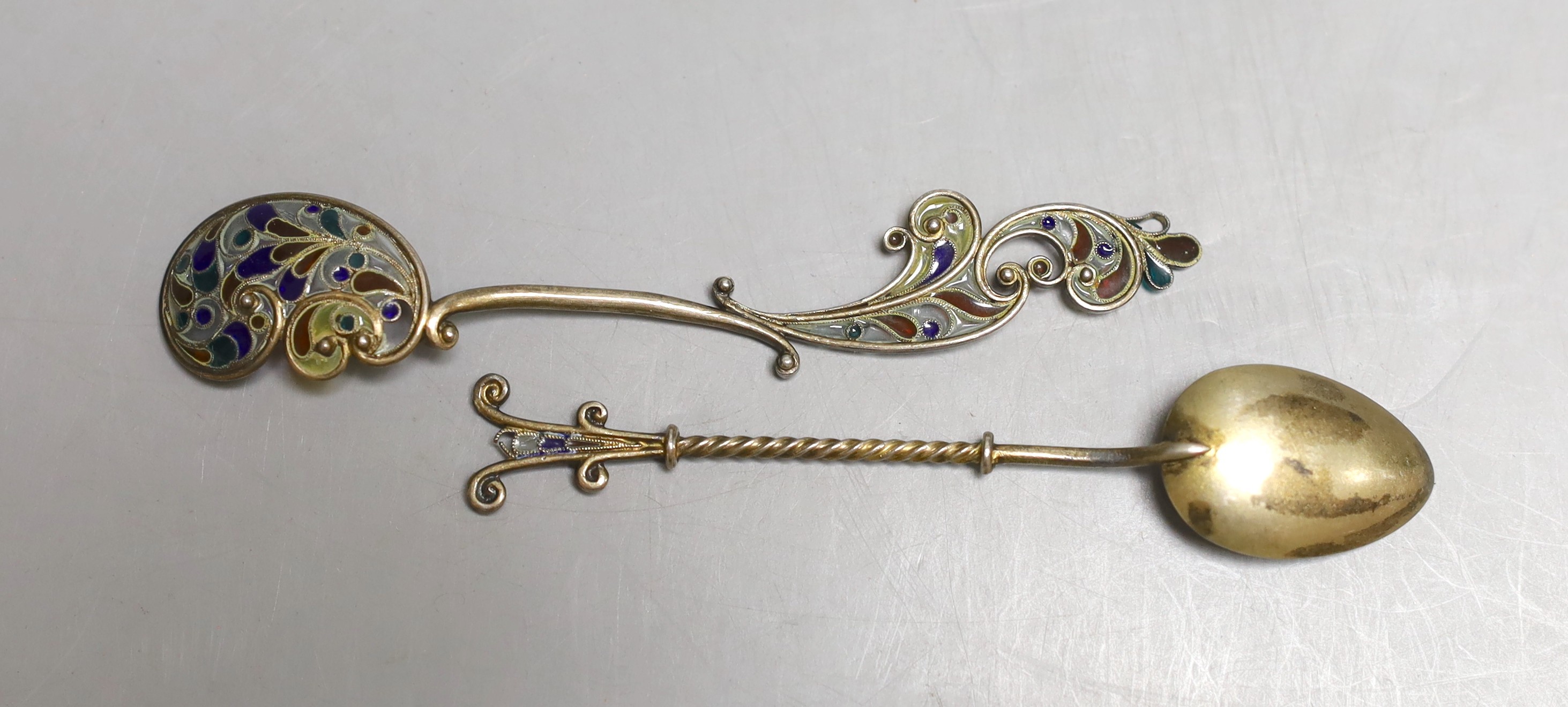 A small collection of eleven assorted Scandinavian gilt white metal and plique a jour small spoons, including four pairs, longest 11.8cm.